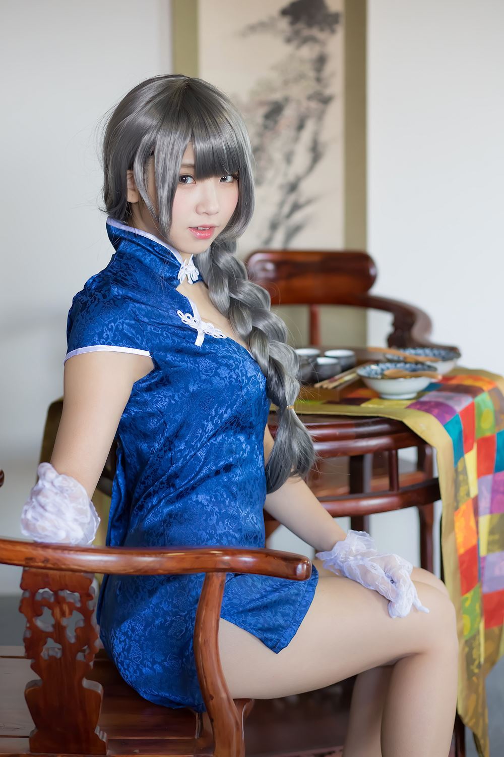 Blue cheongsam and legs of Chinese lady