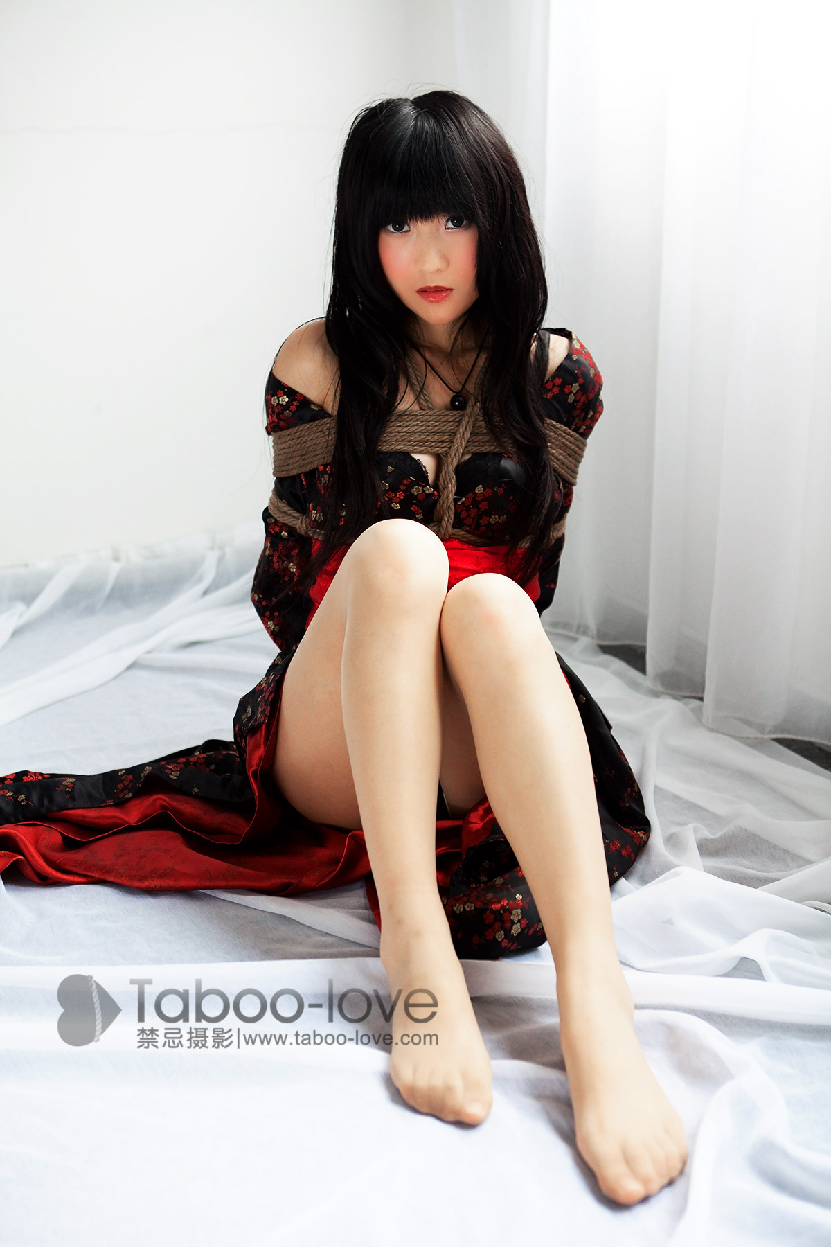 Japanese doll taboo love rope art in sunshine room